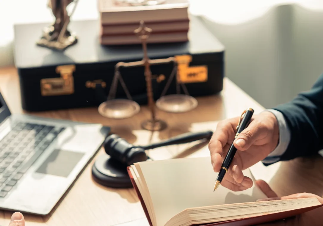 Legal desk with gavel and scales
